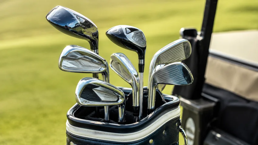 Golf bag and clubs at a driving range