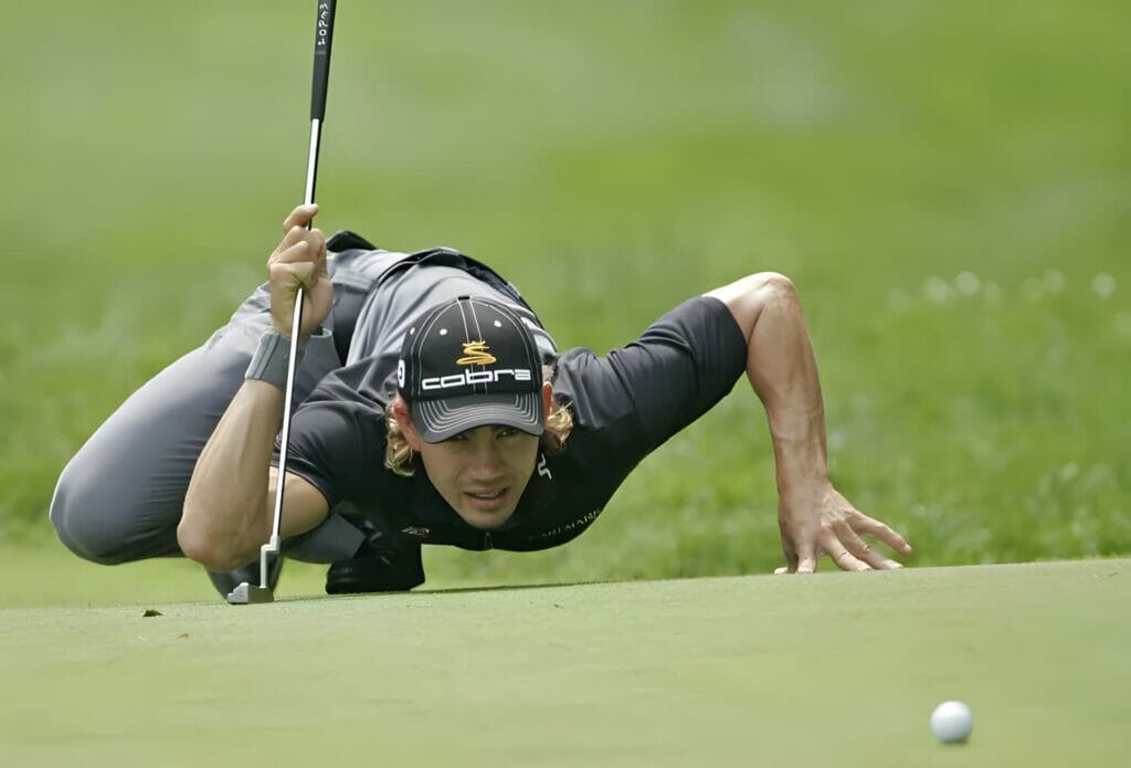 Golfer reading the putt