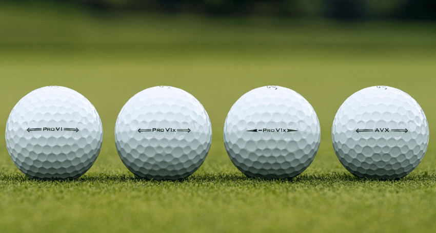 Four Titleist golf balls arranged in a row on a grassy surface, each labeled with different text: "Pro V1," "Pro V1x," "Pro V1x," and "AVX." Discover the range of performance each golf ball offers.